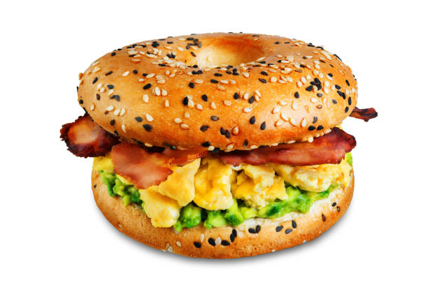 istock Fried bacon avocado cheese egg salad  bagel on a white isolated background 1205824230