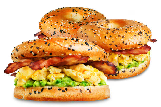 istock Fried bacon avocado cheese egg salad  bagel on a white isolated background 1205824284