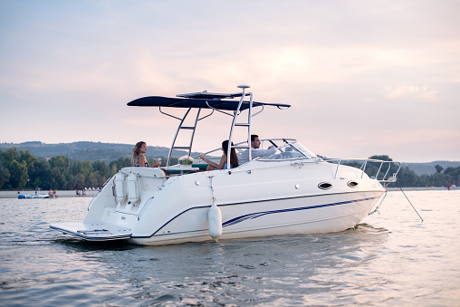 Boat in a summer sunset, ready for party