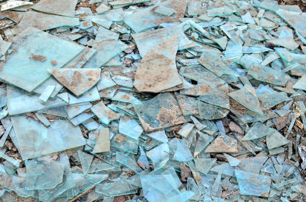 istock Many broken glass pieces on the ground, can be used as a background, texture 1205825916