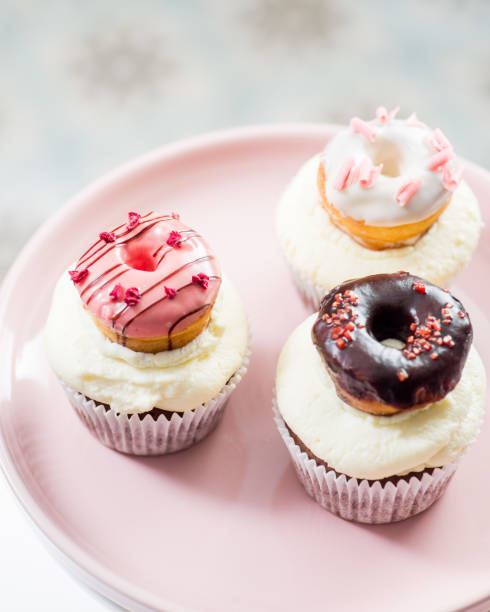 cupcakes with icing and small decorative donuts