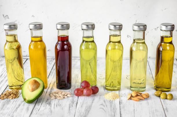 Assortment of vegetable oils Assortment of vegetable oils in bottles cooking oil photos stock pictures, royalty-free photos & images