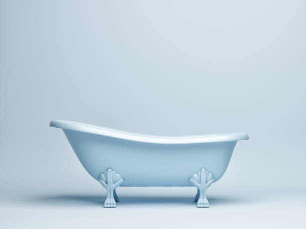 hand holds a shiny shower head and pours water into a blue plastic bucket. Close-up
