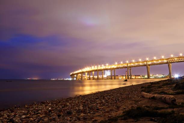 istock colorful night cityscape with illuminated bridge over river 1205839596