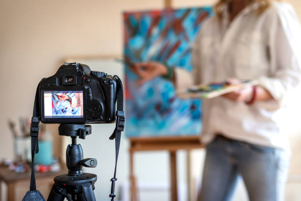 istock Creative woman vlogging her painting technique and skill 1205840535
