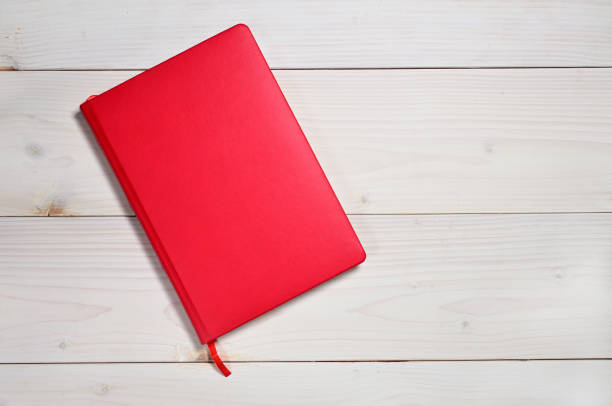 red notebook on a white wooden background - book photo album publication open imagens e fotografias de stock