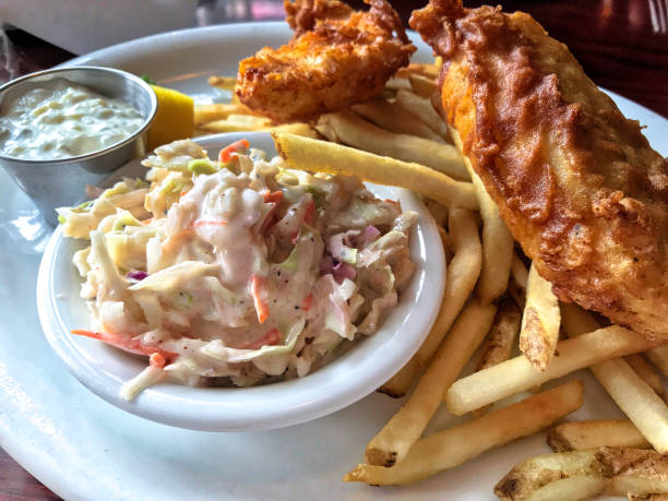 A plate of Fish and Chips woth coleslaw - image