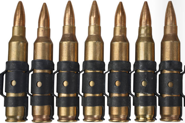 istock 5.56mm NATO ammunition belt on white 1205843424