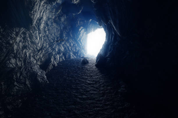 istock 3d rendering of ice cave with bright light at the end of tunnel 1205843631