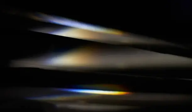 Prism dispersing sunlight splitting into a spectrum macro view