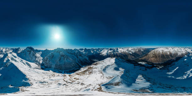 istock Panoramic 360 degree aerial drone view of snowy mountains 1205844805