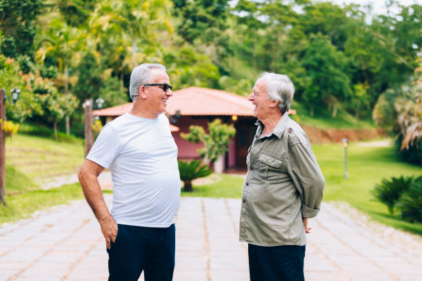 istock Two senior men talking outdoors 1205845744