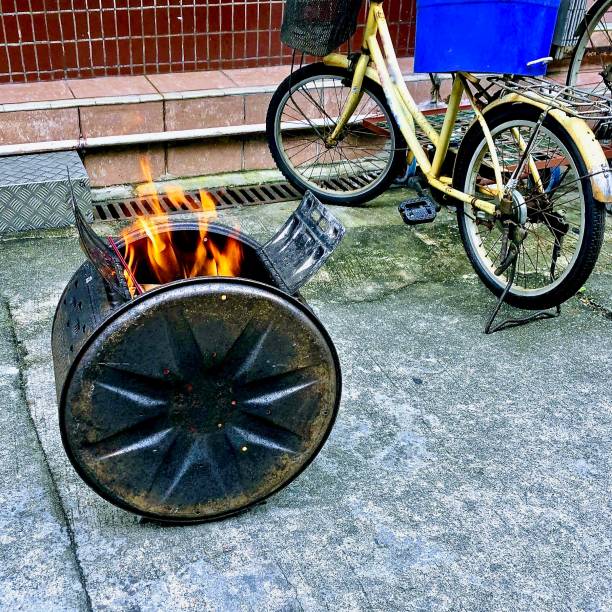 istock Fire in small oven near bicycle 1205845873