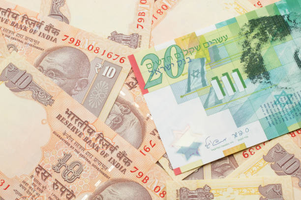 istock A twenty shekel note from Israel on a bed of one dollar bills 1205846041