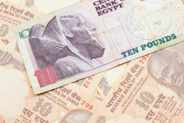 istock An Egyptian ten pound note with Indian ten rupee bank notes 1205846625