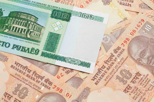 istock A Belorussian one hundred ruble bank note with Indian ten rupee bank notes 1205846816