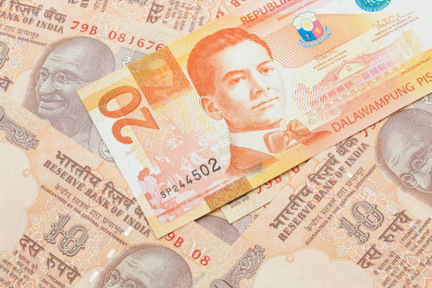 istock A Filipino piso bill with Indian ten rupee bank notes 1205846881