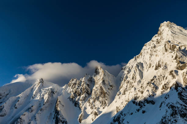 istock Steep snow covered mountain ridge landscape with blue sky, Himalaya 1205848894