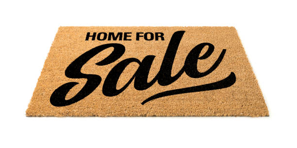 istock Home For Sale Welcome Mat Isolated On A White Background 1205849574