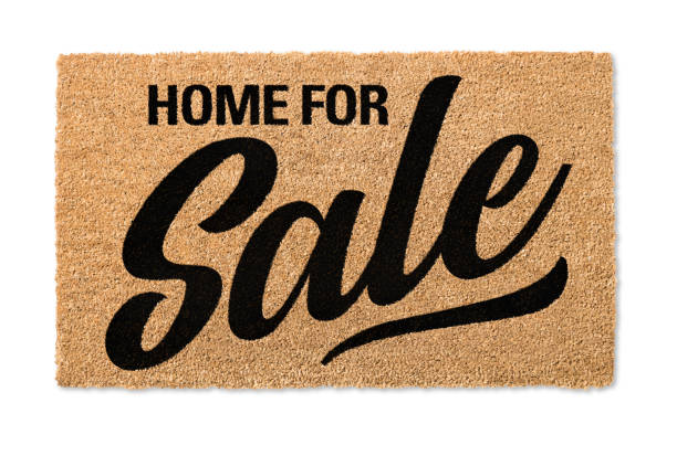 istock Home For Sale Welcome Mat Isolated On A White Background with Clipping Path 1205849619