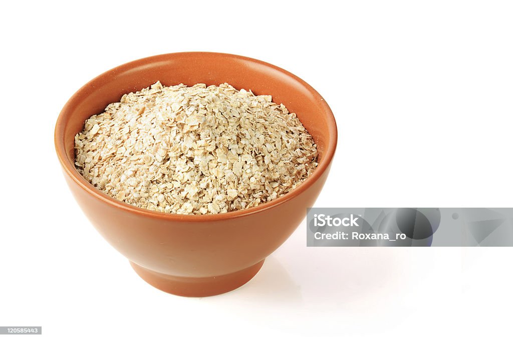 Oat in a bowl dry oat grains in brown clay bowl Bowl Stock Photo