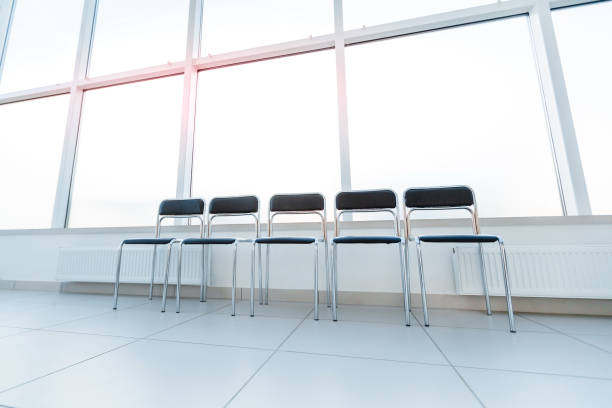 istock row of chairs in the office hallway . 1205862139