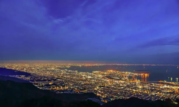 Photo of Kobe city panoramic view from Mt. Maya Kikusedai park observatory platform in sunny day sunset time