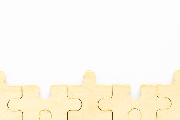istock wooden jigsaw puzzle pieces on white background 1205871345