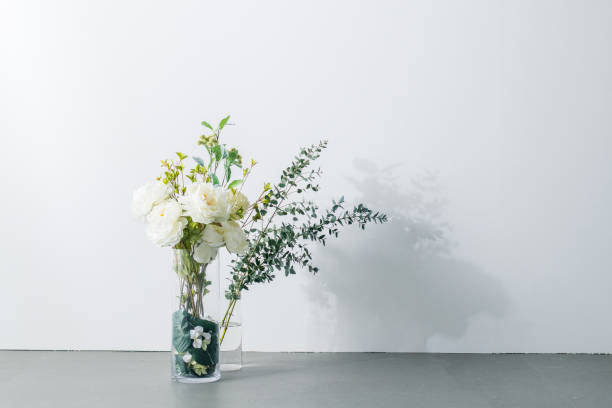 istock Bouquet in vase on white background. Modern lifestyle concept. 1205875574