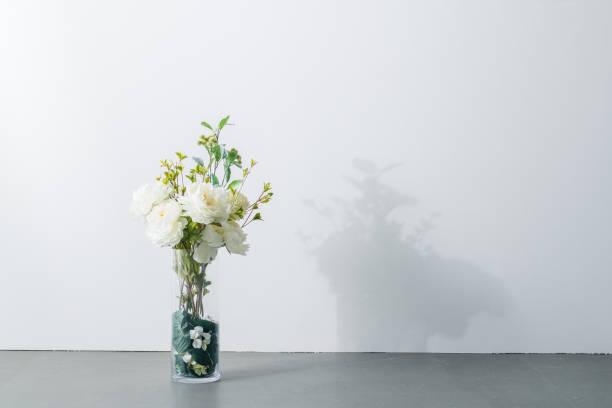 istock Bouquet in vase on white background. Modern lifestyle concept. 1205875625
