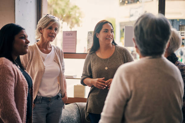 more than a club, it's a community - senior adult multi ethnic group friendship women imagens e fotografias de stock