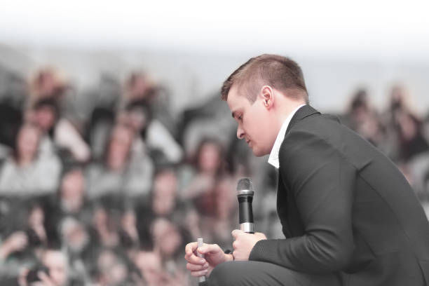 istock speaker discusses something with the journalist during the brief 1205882994