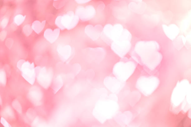 istock Heart shaped bokeh pink background detail art 1205887125