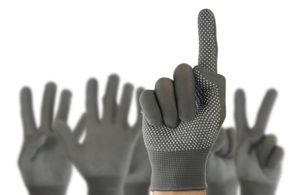 istock one to five fingers hand in glove on white background close-up 1205887229