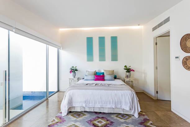 istock Vogue style bedroom with teal colour and pool access 1205887295