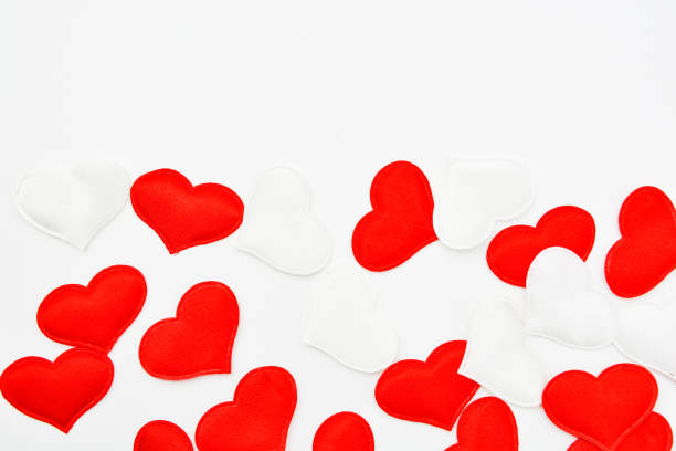 istock Red and white fabric hearts on a white background. Theme for Valentine's Day and holidays 1205887321