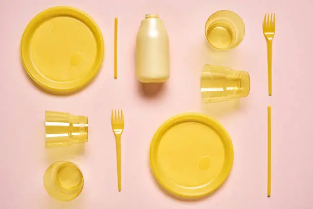 Photo of Yellow Plastic Utensil Flat Lay