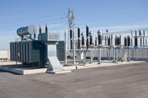Delivery of electricity. High-voltage substation with power line and Insulator