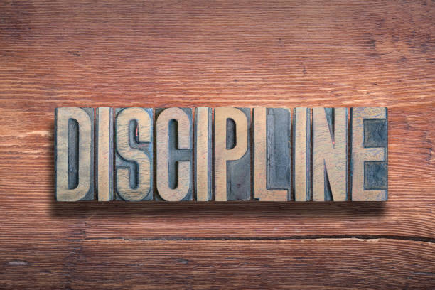 istock discipline word wood 1205891951