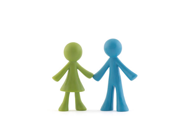 istock Pair of green and blue figurines on white background with clipping path 1205892082