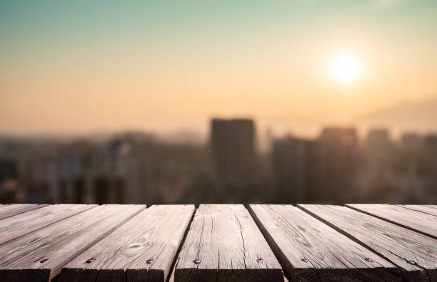 istock Empty wooden platform with urban skyline background 1205893222