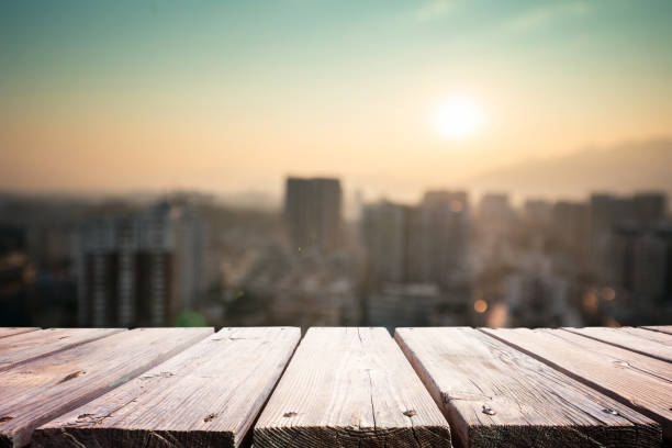 istock Empty wooden platform with urban skyline background 1205893456