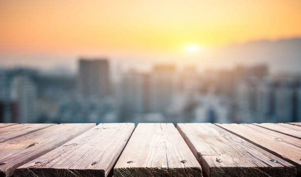 istock Wooden platform with city in the morning 1205893623