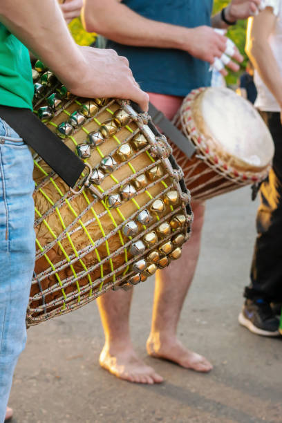 istock African drums there there, men playing Djemba, hands close-up 1205894666