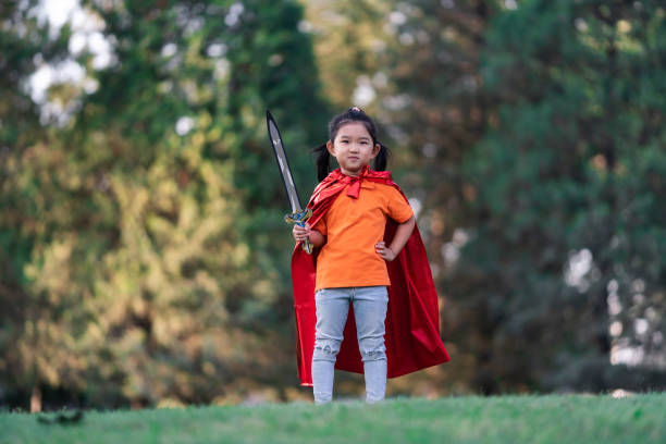 istock Wonder Girl Holding a Sword 1205904594