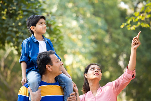 istock Happy family at park 1205904748