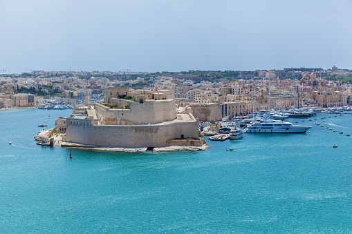 View of Vittoriosa harbor and the battery of medieval cannons from the wall of Valletta. Salyutovaya battery and the large Harbor of Valletta. View of the Grand Harbor from the Upper Gardens Barrakka in the capital of Malta, Valletta.