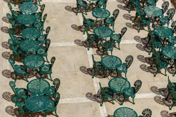 istock An interior of an open-air cafe with tables and chairs 1205905989