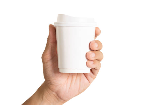 istock paper cup of coffee hold on hand empty copy space advertising packaging branding mock-up isolated on white background clipping path 1205908098