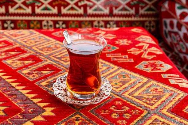 istock Hot Turkish Tea Cup on a Table with traditional Turkish Tablecloth 1205908736